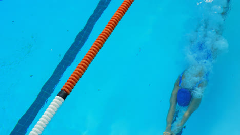 female swimmer jumping into swimming pool 4k