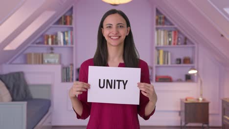happy indian woman holding unity banner