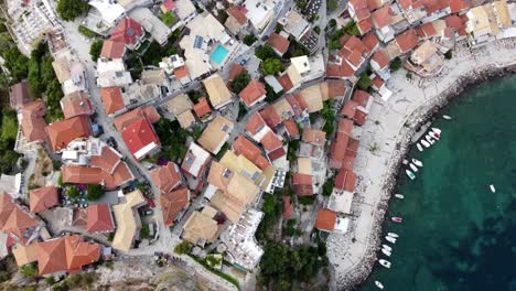 overhead drone shot of parga seaside town traditional houses, greece