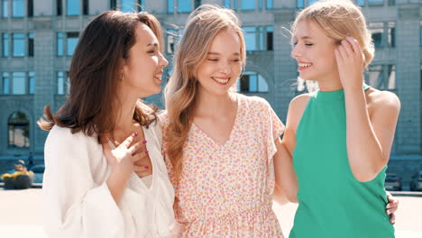 three friends enjoying a conversation in the city