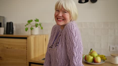 smiling senior woman in kitchen