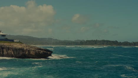 the-beautiful-blue-Pacific-ocean-with-soothing-waves-against-a-rocky-peninsula-and-the-shoreline-in-Honolulu,-Hawaii