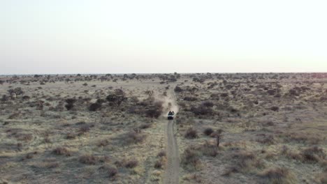 isolated jeep crossing desert in namibia