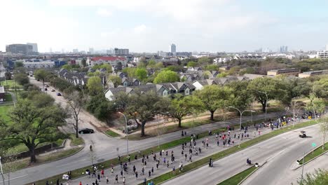 aerial of people competing in city marathon on the main road