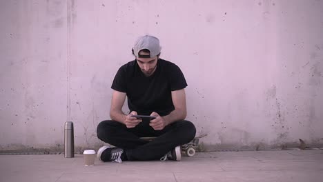 Young Man Working on Laptop Outdoors at Night