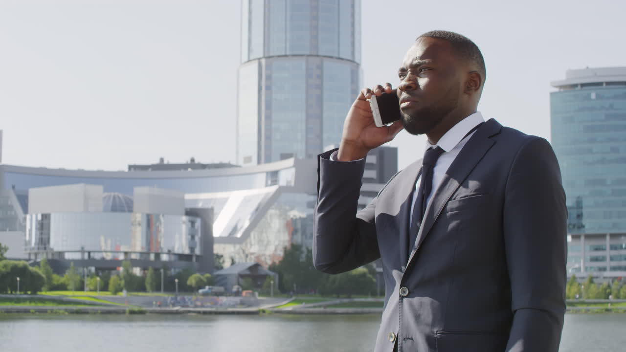 Black Business Man Talking On Phone Outdoors