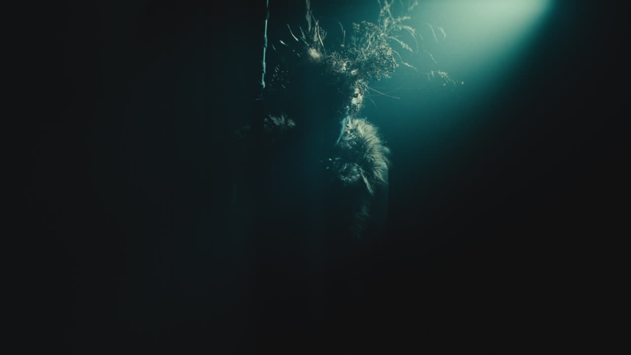 A creepy witch rises her head during the night storm