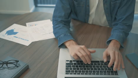 Male-Hands-Typing-On-Laptop-Telecommuting