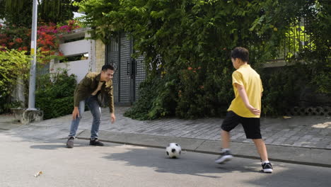 asian man and boy having fun outdoor