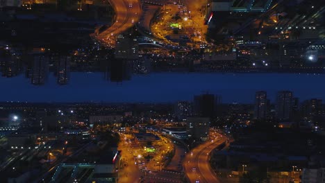 inverted night cityscape aerial view