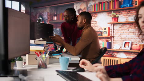 team of ai startup workers conducting code review on pc to fix bugs