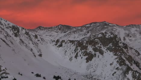 last light winter solstice december snowy rocky mountains peaks golden hour aerial drone colorado continental divide loveland pass herman gulch coon hill vibrant sunset dusk rugged parallax right