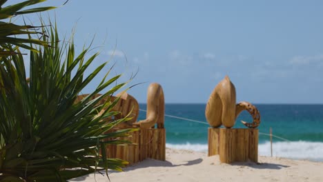 wood sculpture on currumbin beach, gold coast