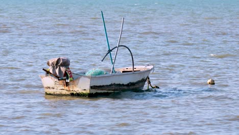 a lone boat floats gently in pattaya