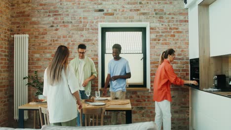 friends gathering for dinner in modern apartment