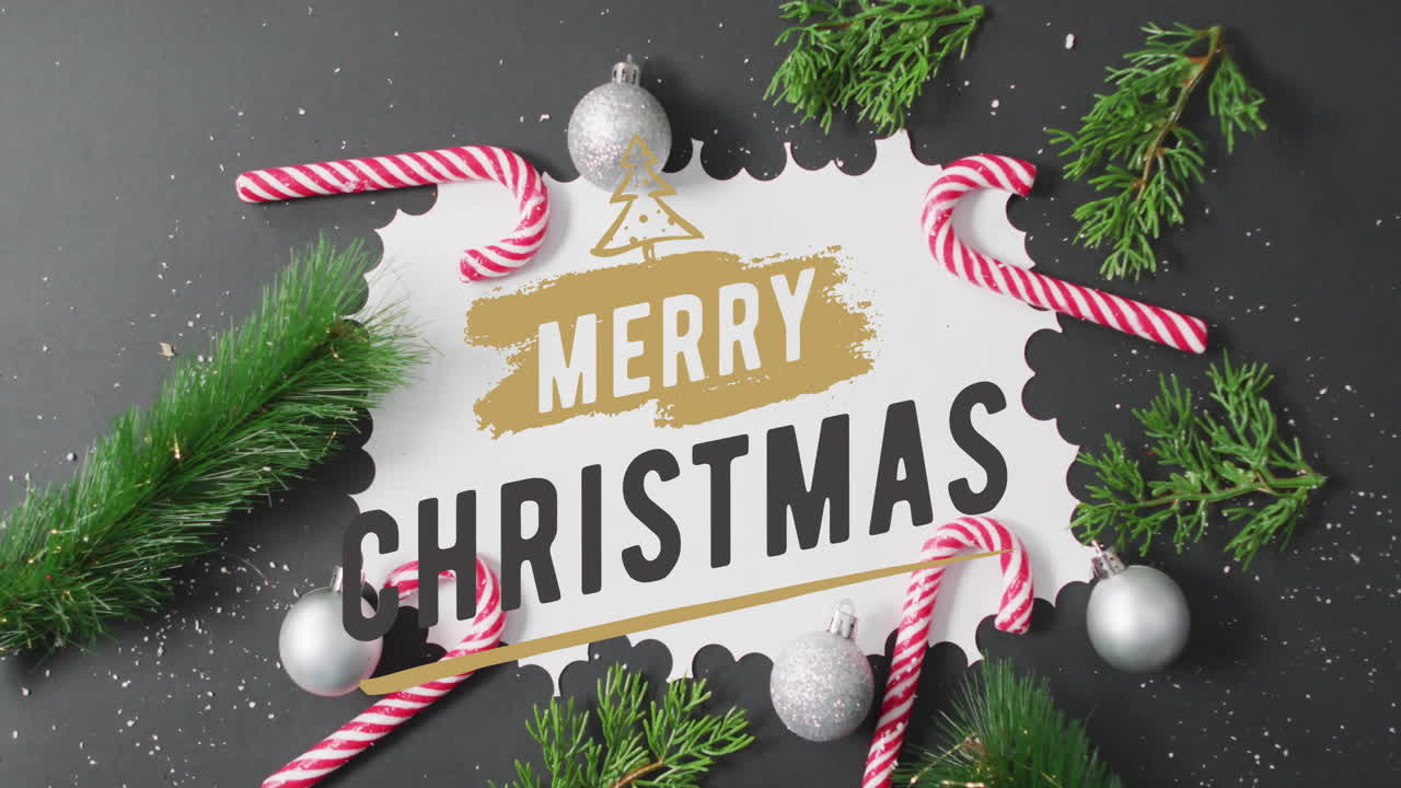 animación del texto de feliz navidad sobre las decoraciones navideñas