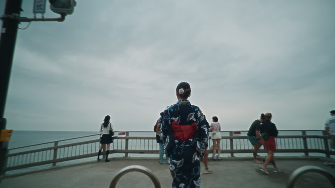 Woman in Yukata at a Pedestrian Crossing