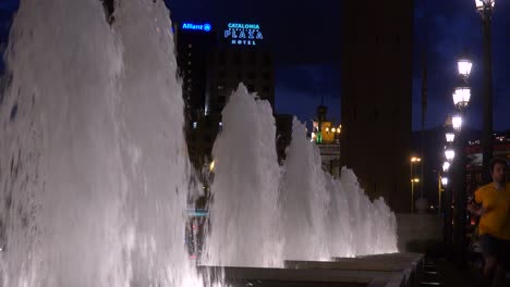 fountains dance in barcelona spain with a hotel background