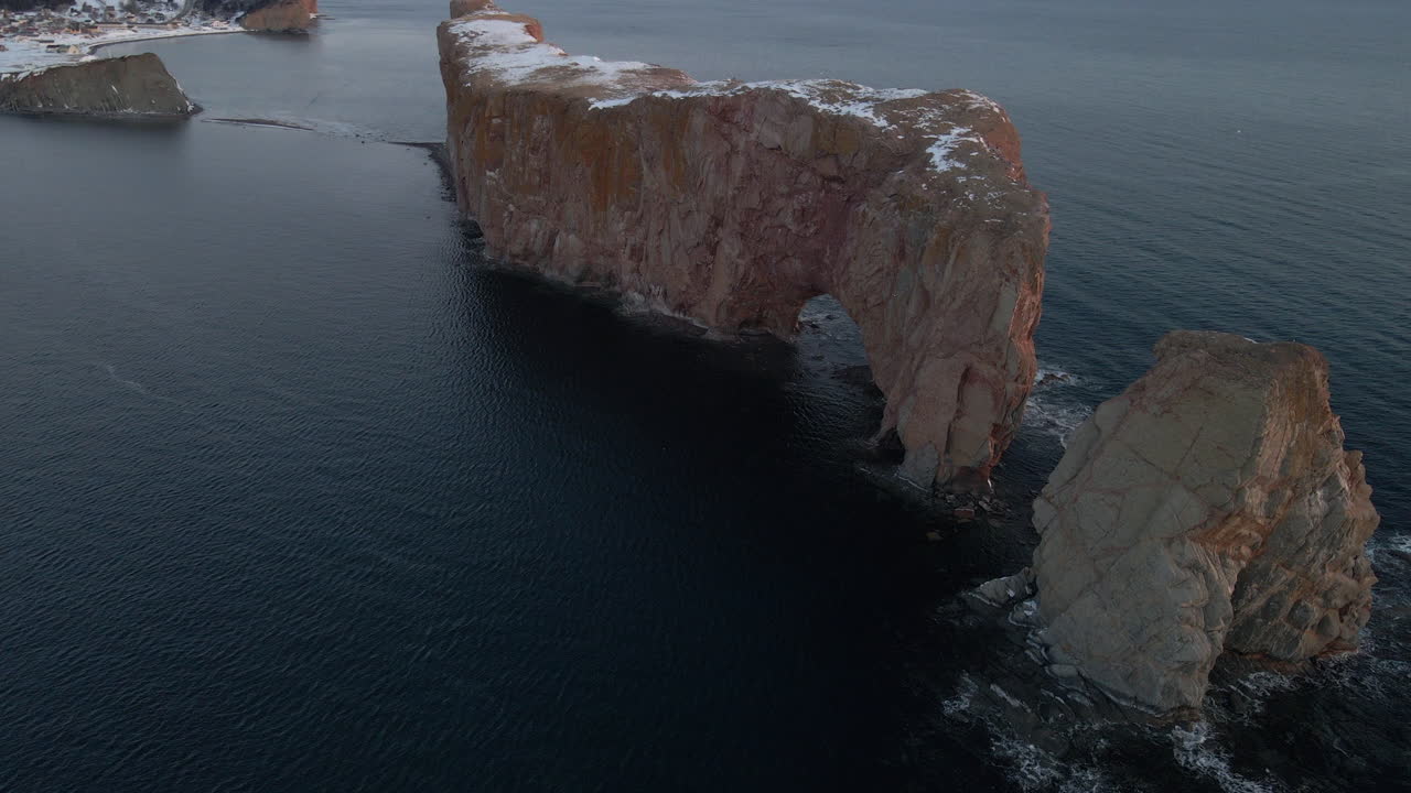 Cinematic drone shot of famous Perce rock in Quebec, Canada
