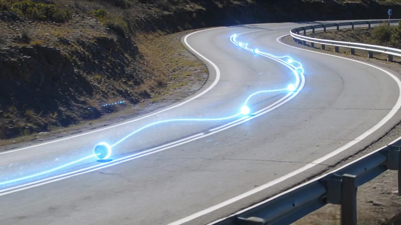 Appearing at left centerline, blue orb moving along mountain road, tracing curve near guardrail