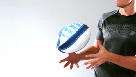 serious rugby player catching ball