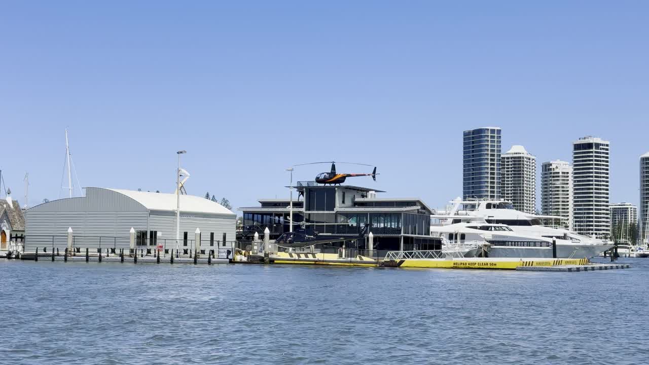 Helicopter departs from marina helipad in Gold Coast