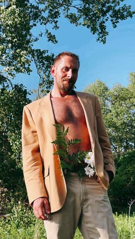 man in a beige jacket with flowers