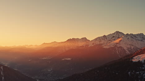 picturesque warm sunset over italian alps in wintertime