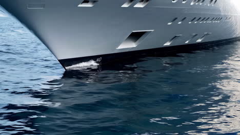 bow of a large yacht on blue water