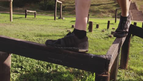 young man training at an outdoor gym bootcamp