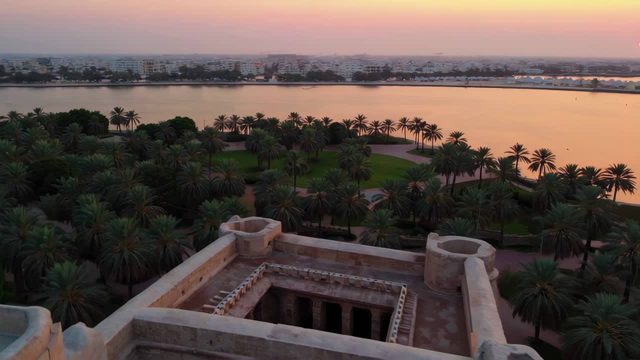 Aerial View of a Historical Fort at Sunset/Sunrise over a Lake and Palm Trees Park