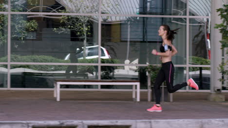 athletic running fitness woman in urban city