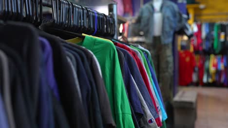 a vintage clothing shop in east london with clothes on rails, jean jackets, eclectic fashion experience
