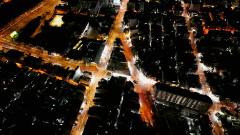 soar above city traffic in this top-down stock video. vibrant lights and flowing vehicles create a dynamic urban scene under twilight skies