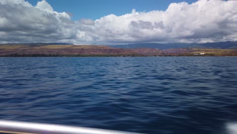 gimbal wide shot of waimea canyon from a moving speed boat off the coast of kaua'i, hawai'i