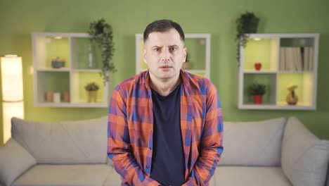 the eyes of a frightened man look around in fear.