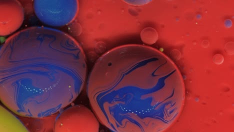 red-blue bubbles on a red background. abstract textural art. liquid forms of design.