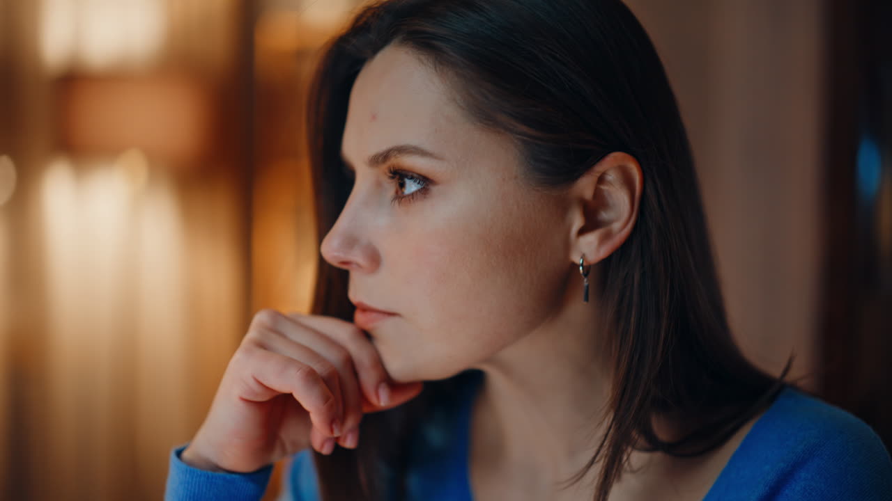 Remote worker thinking project sitting apartment workplace in lamp light closeup