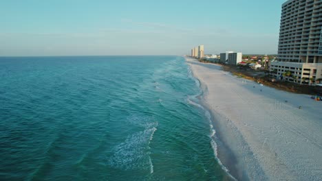 Aerial-flight-parallel-to-Panama-City-Beach---large-condos-and-beautiful-pristine-beach-and-Gulf-of-Mexico