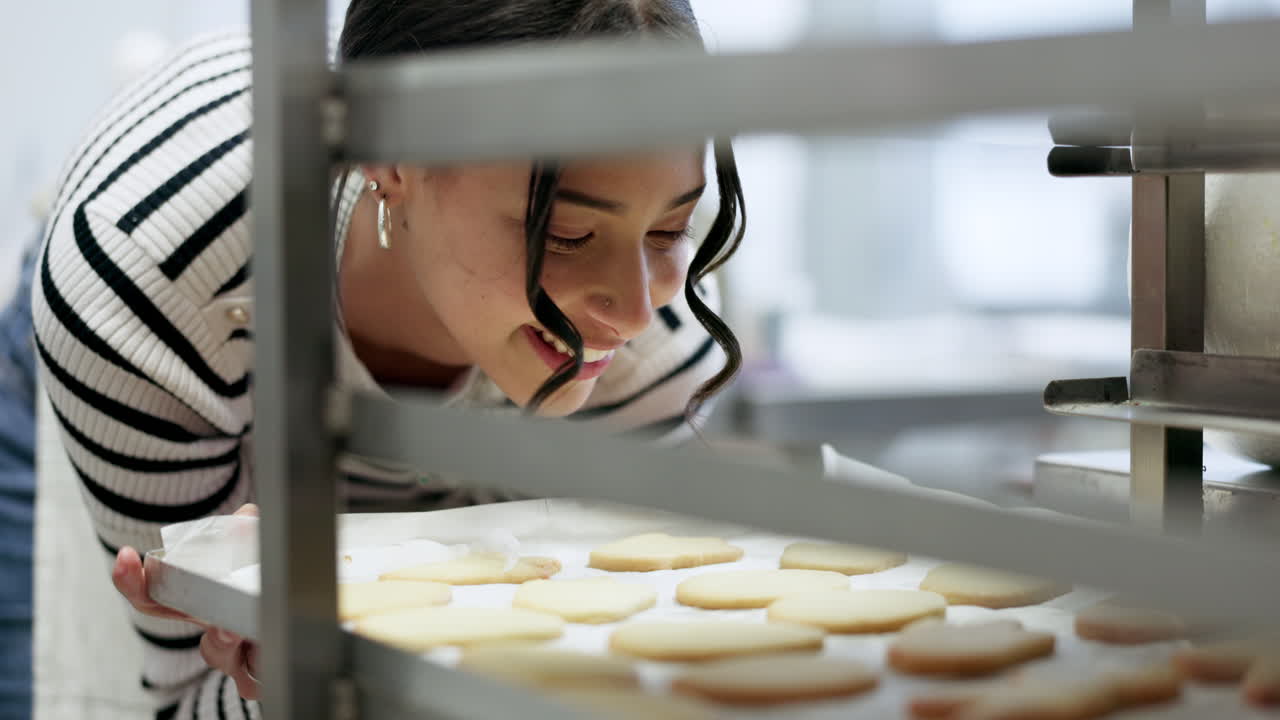 Bakery, happy woman and kitchen with cookies