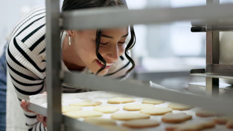 bakery, happy woman and kitchen with cookies