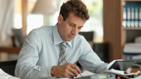 businessman working on documents and calculations