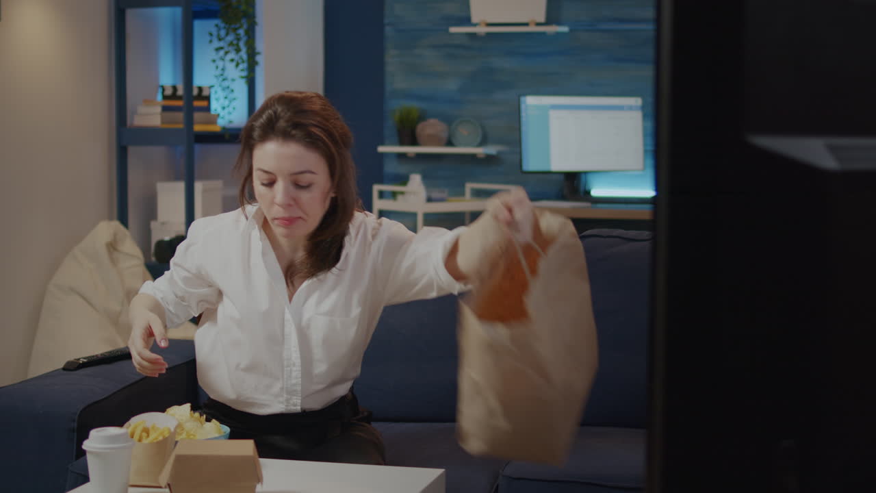 Person putting takeout fast food boxes on table