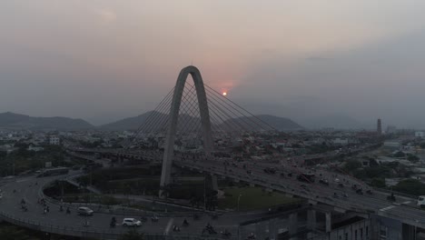 aerial drone footage of multi-level complex overpass transport in asia, loaded with traffic. urbanization and development concept.