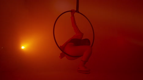 aerial hoop performance in red light