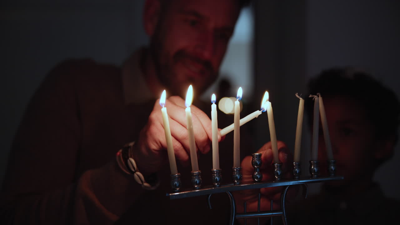 Jewish, holiday and a family lighting candles
