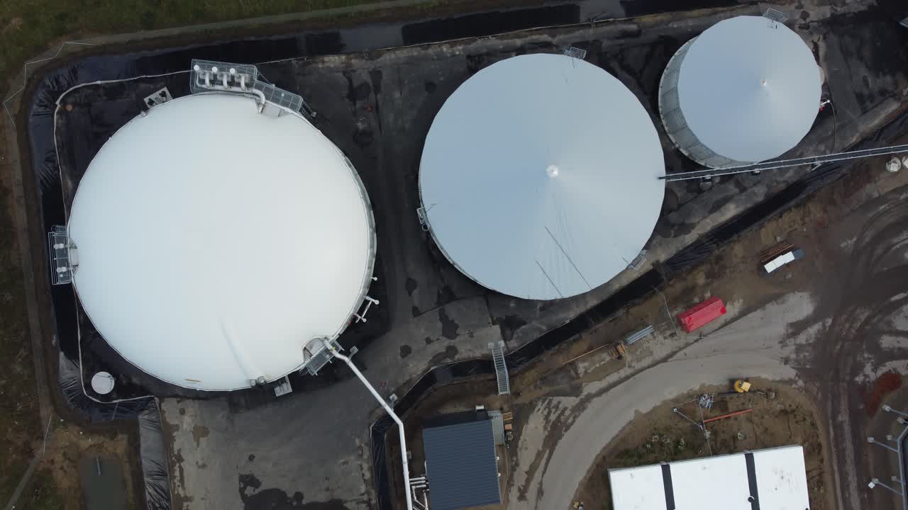 Top down drone view of a biogas plant in rural Denmark, showing circular infrastructure and renewable energy processing systems