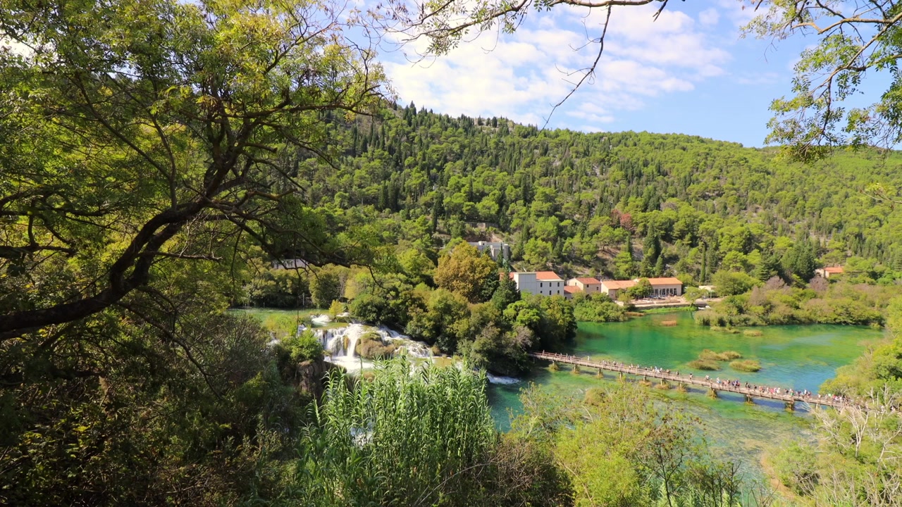 Breathtaking aerial view of Plitvice Lakes National Park in Croatia, showcasing the lush greenery, turquoise waters, and stunning natural scenery. Ideal for travel, nature, and landscape projects.