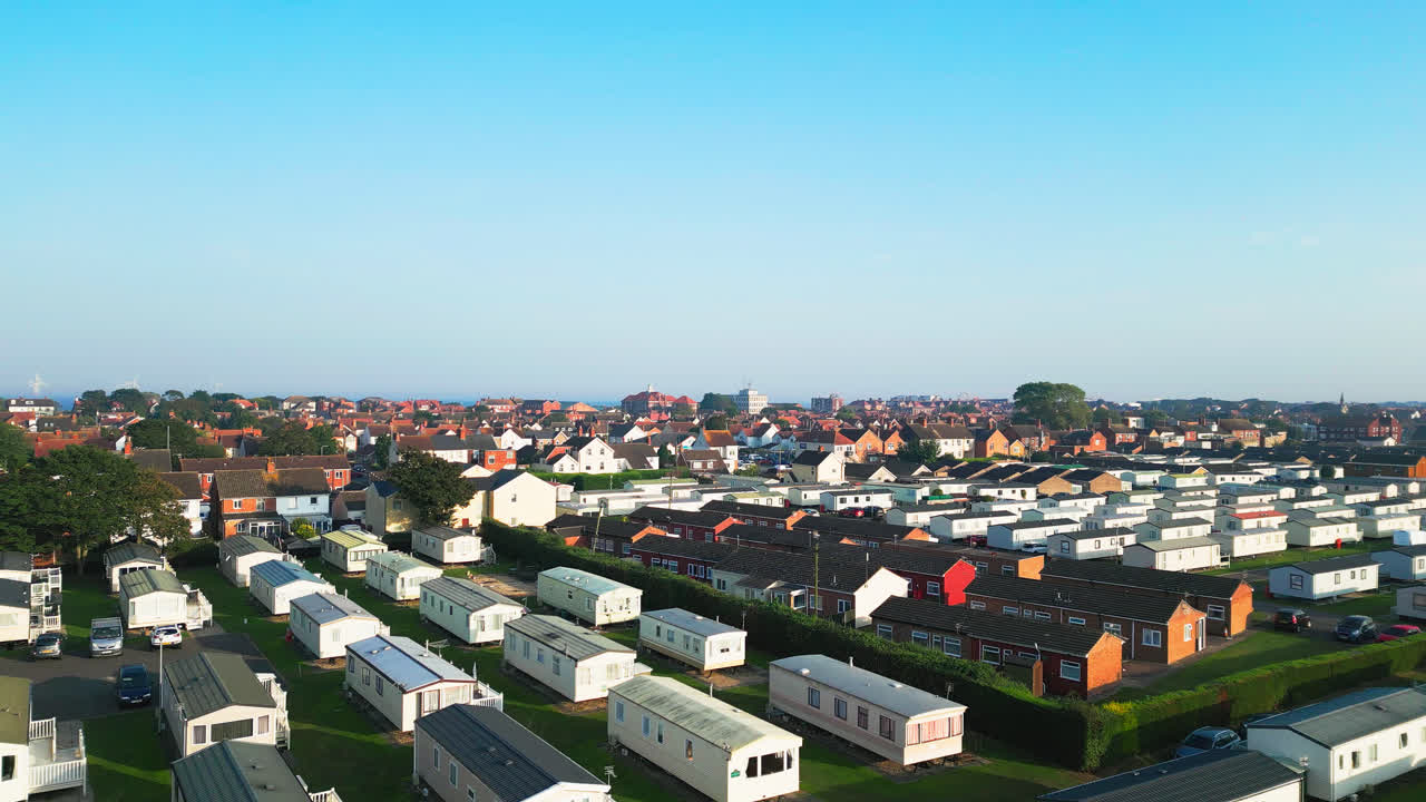 Aerial footage unveils Skegness's holiday parks with caravans, holiday homes, and the surrounding countryside on a summer evening