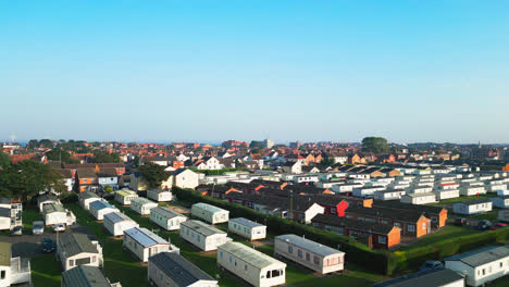 aerial footage unveils skegness's holiday parks with caravans, holiday homes, and the surrounding countryside on a summer evening